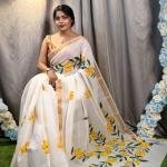 Sun-Kissed Bloom: Off-White Kerala Cotton Saree with Hand-Painted Yellow Florals & Gold Border