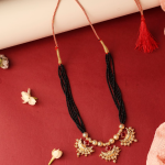 Traditional Gold-Plated Mangalsutra Necklace Featuring Black Beads And Red Stone Embellishments