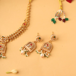 Gold-Plated Choker Necklace Set With White, Green, And Red Artificial Stone-Studded And Beaded Details
