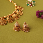Gold-Plated Temple Jewellery Necklace And Earrings Set With Red And Green Kempu Stones
